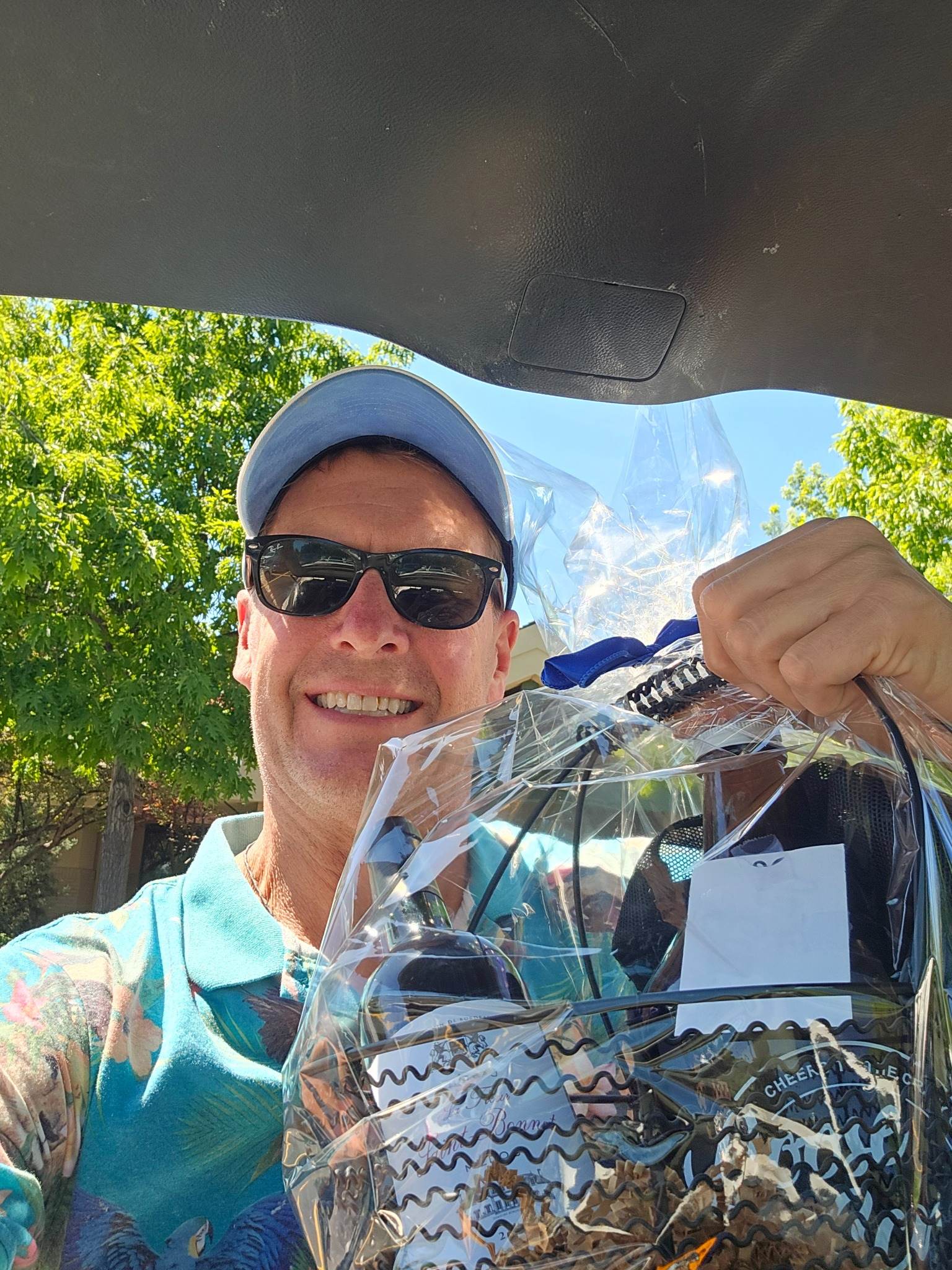Colon Cancer Classic tournament participant with prize basket